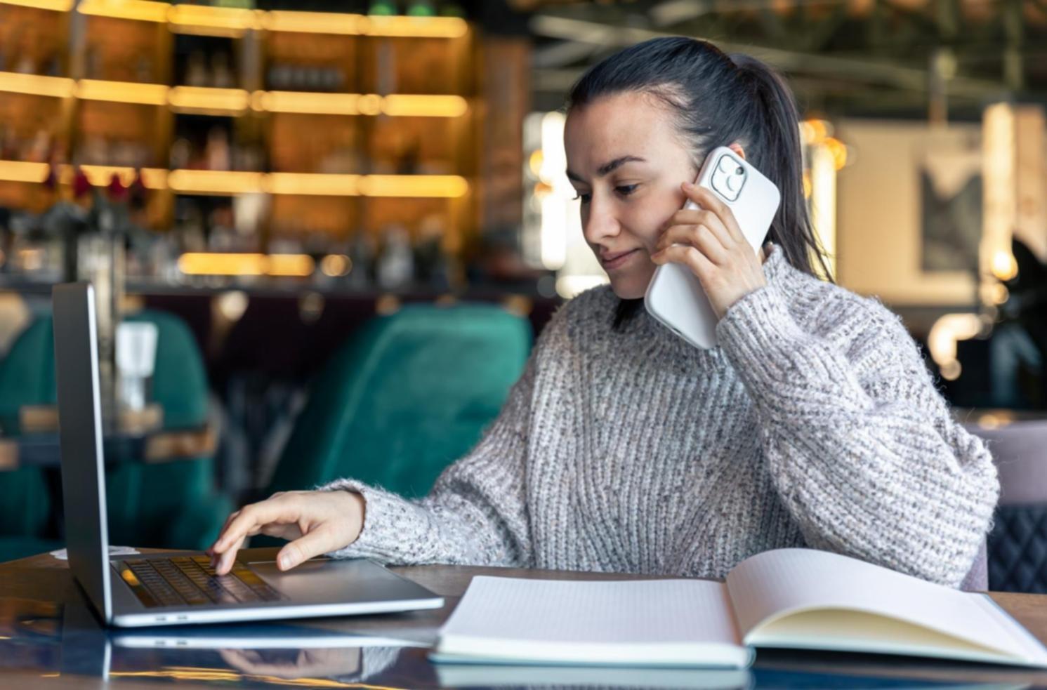 Financial analyst reviewing statistical reports and data visualizations on computer screens
