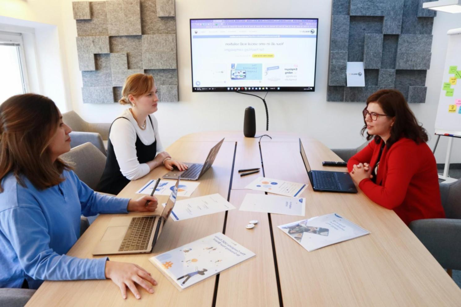 Collaborative financial planning session with multiple team members reviewing business growth strategies